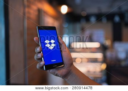 Chiang Mai, Thailand - June 09,2018: Man Holding Huawei With Dropbox On Screen. Dropbox Is A Service