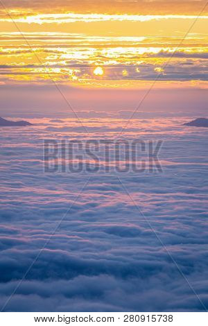 Aerial View Of Cloudy Winter Sky, Fog And Cloud Cover Mountain Peak At Sunrise Of Phu Chi Fah, Chain