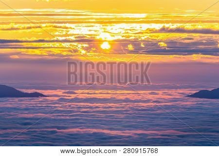 Aerial View Of Cloudy Winter Sky, Fog And Cloud Cover Mountain Peak At Sunrise Of Phu Chi Fah, Chain