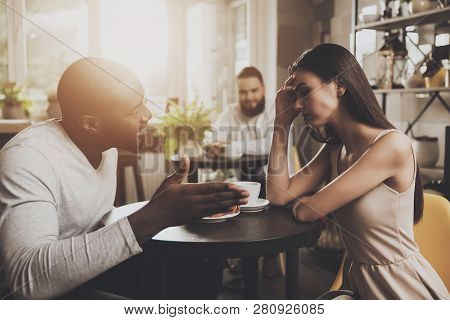 Young Couple Men And Women Find Out The Relationship. Young African American Man And Beautiful Girl 