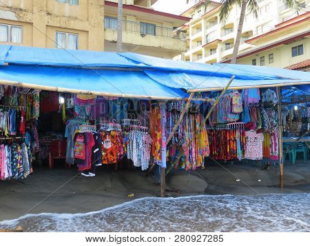 Anyer, Indonesia - June 27, 2018: Street Stalls Around The Sambolo Beach Anyer Selling Clothes And F