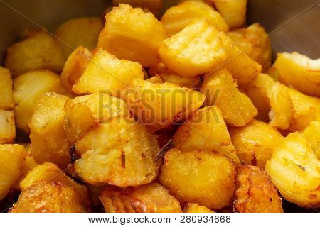 Fried Potatoes With A Golden Crust In A Deep Fryer, Close-up. Junk Food, Spud