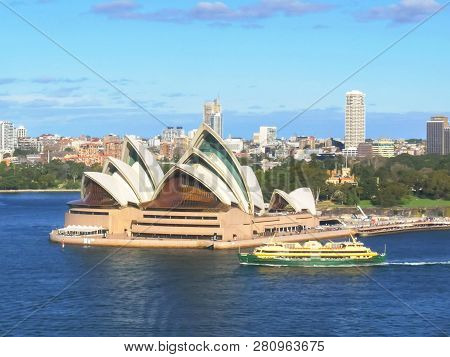 Sydney, Australia - July 1 2014: The Manly Ferry Sails Past The Sydney Opera House Viewed From The B