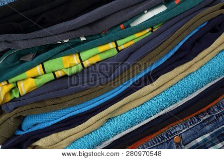 Clothes, Shoes And Accessories - Closeup Group Stack Pile Clotes Diagonal Background