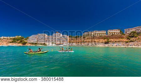 PORT ADRIANO, MALLORCA, SPAIN - 23 July 2020 - Tourists enjoying summer day on the popular city beach.
