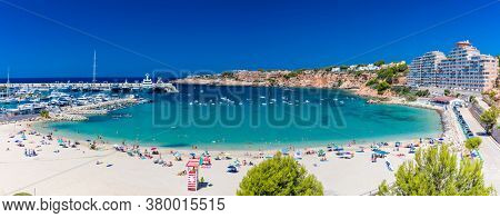 PORT ADRIANO, MALLORCA, SPAIN - 23 July 2020 - Tourists enjoying summer day on the popular city beach.