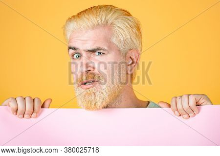 Man Holding Blank Paper Board Studio Portrait. Blank, Empty Paper, Billboard With Copy Space For Tex