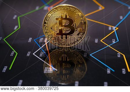 Closeup Of Gold Bitcoin Over Value Graph