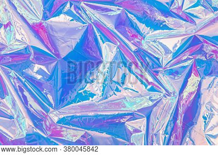 Blurred Abstract Modern Pastel Colored Holographic Background In 80s Style. Crumpled Iridescent Foil