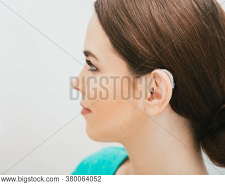 Bte Hearing Aid On Female Ear. Deafness Treatment, Hearing Solution