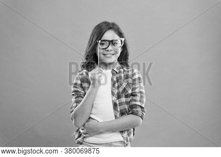 Happy Kid In Funny Party Glasses. School Girl Having Fun. Childhood Happiness. Child In Good And Pos