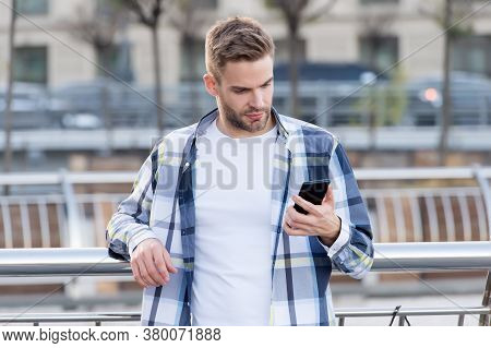 Your True Companion. Handsome Man Use Phone Outdoors. Online Chatting. Sms Message. Mobile Phone Mes