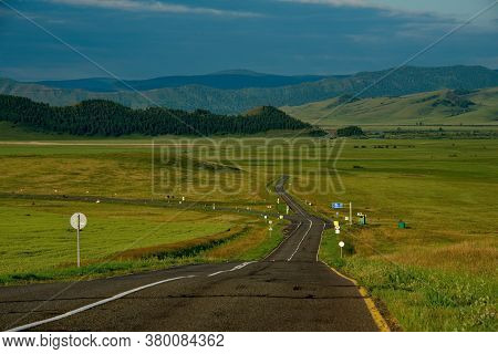 Russia. Republic Of Khakasia. Endless Steppes Among Picturesque Hilly Mountains Near The Village Of 