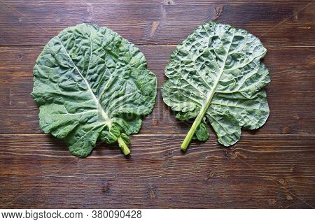 Rastan ( Collard Greens, Collards ) - Popular Leafy Vegetables In Balkan Cuisine. Dark Rustic Backgr
