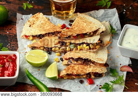 Vegetarian Mexican Black Beans Tomato Cheese And Corn Quesadilla Served With Cold Beer Salsa And Yog