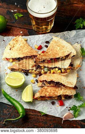 Vegetarian Mexican Black Beans Tomato Cheese And Corn Quesadilla Served With Cold Beer Salsa And Yog