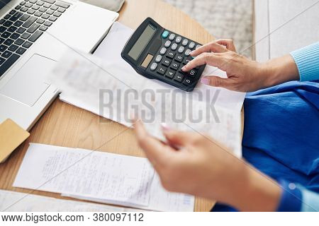 Hands Of Housewife Doing Home Accountig And Calculating Expences And Incomes