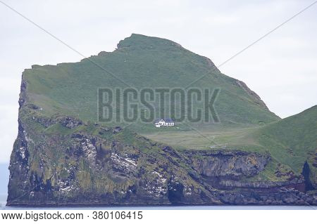 Lonely House On The Island Of The Vestmannaeyjar Archipelago. Iceland