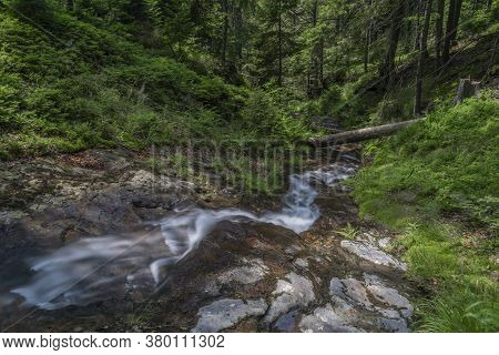 Waterfall On Divoky Creek Near Kouty Nad Desnou Village In Summer Day