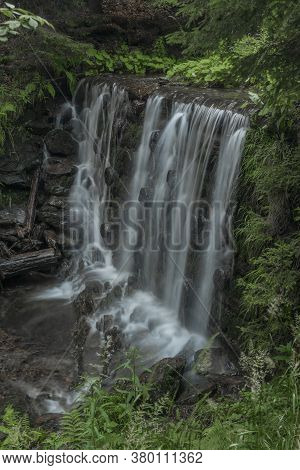 Waterfall On Divoky Creek Near Kouty Nad Desnou Village In Summer Day