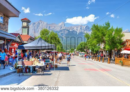 Canmore, Canada - July 30, 2020: Tourists Walk Along Popular Downtown Canmore In The Canadian Rockie