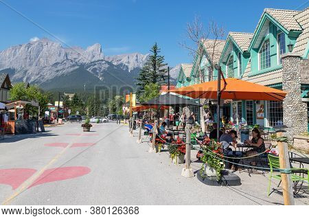 Canmore, Canada - July 30, 2020: Tourists Dining Along Popular Downtown Canmore In The Canadian Rock