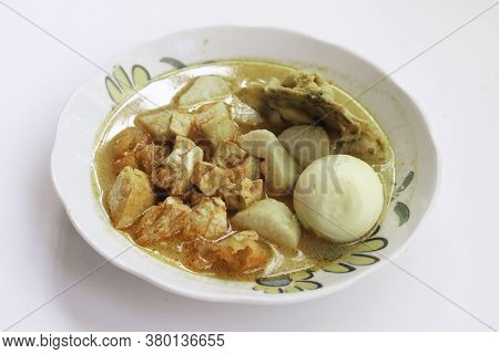 Lontong Sayur Or Ketupat, Indonesian Cuisine. Compressed Rice Cake Or Lontong With Vegetables Cooked