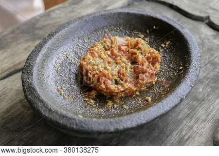 Fresh Sambal Served On Stone Mortar (cobek). Sambal Is Traditional Sauce From Indonesia Made From Ch