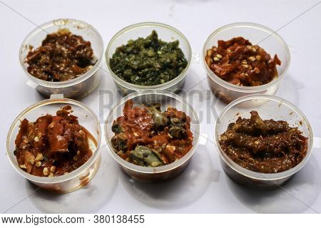 Aneka Sambal Indonesia. Five Kinds Of Indonesian Spicy Condiments Plated In Saucers Of Mini Bowl. A 