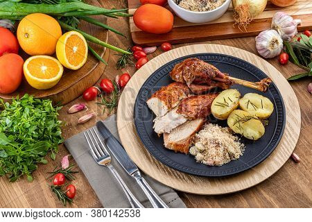 Roasted Turkey Served On A Plate With Farofa, Crumbs And Boiled Potatoes. Thanksgiving Day And Chris