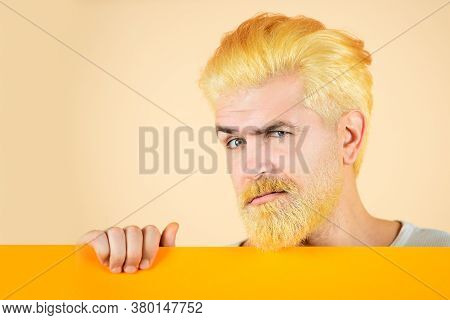 Caucasian Blond Male Model Posing In Fashion Concept Studio Shoot. Happy Middle Age Man Presenting E
