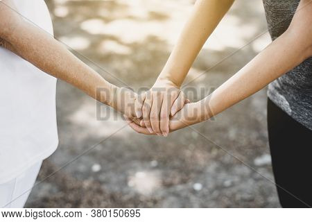 Woman Hands Holding To Elderly With Alzheimer Disease At Home,adult Social Care Concept