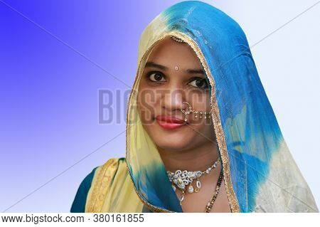 A Beautiful Woman With Gold Styles Jewelry Nath On Isolated Background