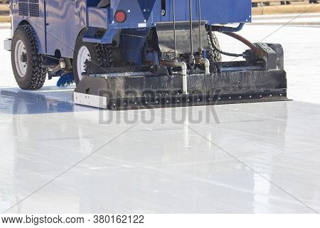 Special Machine For Cleaning Ice On An Ice Rink At Work. Transport Industry