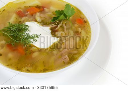 Serving Of Rassolnik - Meat Soup With Pearl Barley And Pickled Cucumbers Seasoned With Sour Cream, F