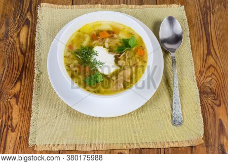 Portion Of Rassolnik - Meat Soup With Pearl Barley And Pickled Cucumbers Seasoned With Sour Cream, S