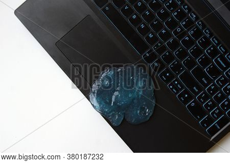 Blue Soft Gel Cleaning Dust On Keyboard. Concept Cleaning Your Computers Keyboard. Office Cleaning.