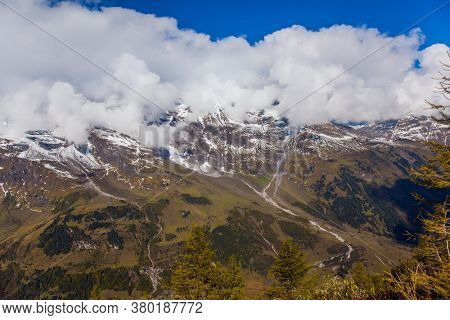 Austria. Grossglockner sightseeing road. The first snow fell on Grossglockner Alpine Road. The road consists of 36 serpentine turns. The roadside is fenced. Ecological and photo tourism concept