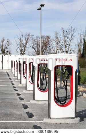 Sance, France - March 15, 2020: Tesla Supercharger Station. Tesla Is An American Automotive And Ener