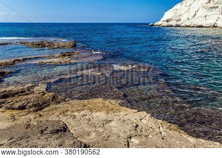 Rocky bay near chalk mountain Rosh a Nikra in northern Israel. The border between Israel and Lebanon. The color of sea water from azure to dark blue. The concept of eco and photo tourism