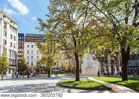 Budapest, Hungary. October 2019: Statue Of Mihaly Vorosmarty And People Walking Near On The Vorosmar
