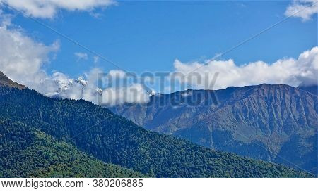 Mountain Landscape In Summer. Three Types Of Slopes In One Photo: Covered With Green Forest, Rocky W