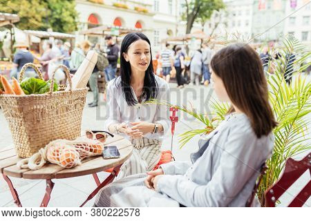 Brunette Slim Sensual Mother And Her Teenager Daughter Relaxing After Shopping At Farmer Market, Sit