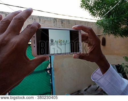 District Katni, India - May 23, 2020: Man Holding Smart Phone With Displayed Ministry Of Food Proces