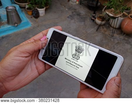 District Katni, India - May 23, 2020: Woman Holding Smart Phone With Displayed Ministry Of Petroleum
