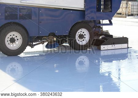 Special Machine For Cleaning Ice On An Ice Rink At Work. Transport Industry