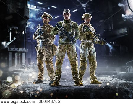 Army Soldiers In Protective Combat Uniform Holding Special Operations Forces Combat Assault Rifle On