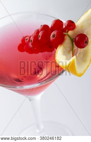 Detail Of Cosmopolitan Cocktail With Vodka, Triple Sec, Cranberry Juice And Freshly Squeezed Lime Ju