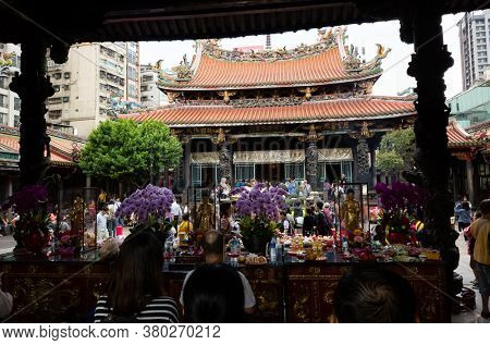 Taipei, Taiwan - October 20th, 2019: people praying in Lungshan temple at Taipei, Taiwan