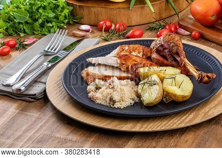 Roasted Turkey Served On A Plate With Farofa, Crumbs And Boiled Potatoes. Thanksgiving Day And Chris
